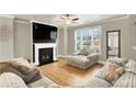 Living room with fireplace and large windows at 2652 Tilson Rd, Decatur, GA 30032