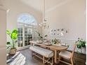 Elegant dining room featuring a large arched window and hardwood floors at 2311 Shoreline Pkwy, Villa Rica, GA 30180