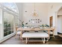 Bright dining room with hardwood floors and a large window at 2311 Shoreline Pkwy, Villa Rica, GA 30180