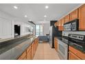 Modern kitchen with stainless steel appliances and granite countertops at 3040 Peachtree Rd # 614, Atlanta, GA 30305