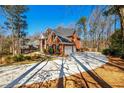 Beautiful brick home with a spacious driveway and manicured front yard at 1105 River Laurel Dr, Suwanee, GA 30024
