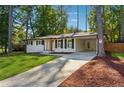 Newly renovated Ranch home with a modern front door and driveway at 1464 Sanden Ferry Dr, Decatur, GA 30033