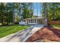 Newly renovated Ranch home with a modern front door and driveway at 1464 Sanden Ferry Dr, Decatur, GA 30033