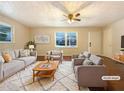 Virtually staged living room with neutral furniture and hardwood floors at 24 Valerie Ln, Powder Springs, GA 30127