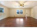 Spacious living room featuring hardwood floors and large windows at 24 Valerie Ln, Powder Springs, GA 30127