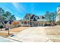 Inviting two-story home with a well-manicured lawn and a spacious driveway leading to a two-car garage at 37 Highcrest Dr, Acworth, GA 30101
