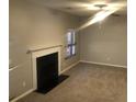 Spacious living room featuring a fireplace, neutral walls, and carpeted floors at 5332 Shirewick Dr, Lithonia, GA 30058
