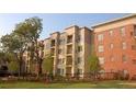 Apartment building with landscaped grounds and trees at 870 Mayson Turner Rd # 1326, Atlanta, GA 30314