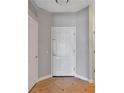 A neutral toned entryway featuring tile flooring, a white front door and white trim at 3475 Oak Valley Ne Rd # 1930, Atlanta, GA 30326