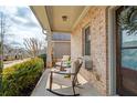Relaxing front porch with comfortable seating, offering a perfect spot to enjoy the neighborhood views at 3000 Smyrna Grove Dr, Smyrna, GA 30082