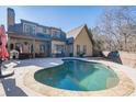 Inviting kidney-shaped pool in backyard oasis; perfect for relaxation and entertaining at 4824 Archer Pl, Acworth, GA 30101