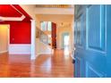Two-story foyer with hardwood floors and a view of the staircase at 1070 Blackwood Ct, Johns Creek, GA 30024