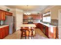 Spacious kitchen with an island, stainless steel appliances, and hardwood floors at 1070 Blackwood Ct, Johns Creek, GA 30024