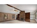 Spacious living room with brick fireplace and built-in shelves at 1836 Poinsetta Dr, Acworth, GA 30102