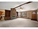 Spacious living room with brick fireplace and built-in shelves at 1836 Poinsetta Dr, Acworth, GA 30102