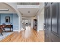 Welcoming foyer with hardwood floors, high ceilings, and staircase with decorative railing at 785 Charleston Dr, Roswell, GA 30075