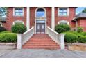 Elegant entryway with brick steps and double doors at 619 Champions Dr, Mcdonough, GA 30253