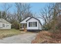 Charming renovated single Gathering home, with a front porch, concrete driveway and siding at 1111 Osborne Sw St, Atlanta, GA 30310