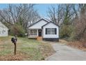 Cozy renovated single Gathering home, featuring a porch with black railings and a black front door at 1111 Osborne Sw St, Atlanta, GA 30310