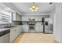 Modern kitchen with stainless steel appliances and light cabinets at 2858 Spring Villa Se Ln, Smyrna, GA 30080