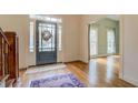 Hardwood floors, two-story foyer, and view into living area at 960 Todd Dr, Covington, GA 30014