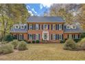 Brick two-story house with gray roof, and landscaping at 960 Todd Dr, Covington, GA 30014