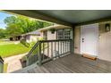 Cozy front porch with a wooden floor and railings, creating a welcoming entrance to the house at 1770 Rockland Se Dr, Atlanta, GA 30316