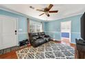 Bright living room with ample natural light, a ceiling fan, and modern furniture at 1770 Rockland Se Dr, Atlanta, GA 30316