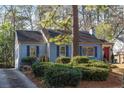 Blue house with landscaping and driveway at 1949 Westminster Ne Way, Atlanta, GA 30307