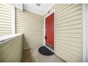 Red front door entry to a townhome unit at 23 Chelsea Ct, Avondale Estates, GA 30002