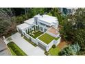 Contemporary home showcasing a unique architectural design and landscaping at 3770 Peachtree Ne Rd, Atlanta, GA 30319