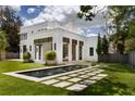Modern rectangular pool with a stone patio and water features at 3770 Peachtree Ne Rd, Atlanta, GA 30319