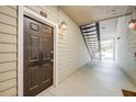 Exterior shot of front door and outdoor hallway with stairs at 1250 Parkwood Se Cir # 1004, Atlanta, GA 30339