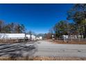 Commercial property with gated entrance, and building in background at 200 Heath Rd, Carrollton, GA 30116