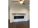Modern fireplace with marble tiling and a sleek electric insert creates a cozy focal point in this living room at 1706 Alvarado Sw Ter, Atlanta, GA 30310