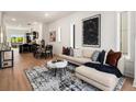 Open concept living space with sectional sofa and large artwork at 2199 Lenox Ne Rd # 14, Atlanta, GA 30324