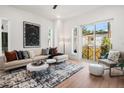 Bright living room featuring a sectional sofa and access to balcony at 2199 Lenox Ne Rd # 14, Atlanta, GA 30324