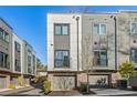 Contemporary townhome community featuring attached garages and sleek design at 2199 Lenox Ne Rd # 13, Atlanta, GA 30324