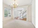 Bright dining room with hardwood floors and a chandelier at 135 Eagles Club Dr, Stockbridge, GA 30281