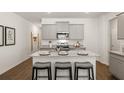 Modern eat-in kitchen features stainless appliances, granite countertops and island seating at 2458 Bayberry St, Acworth, GA 30101