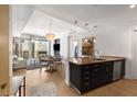 Bright, modern kitchen with granite countertops, stainless steel appliances, and an open view of the living area at 3325 Piedmont Ne Rd # 2407, Atlanta, GA 30305