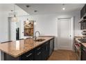 Contemporary kitchen featuring granite countertops, stainless steel appliances, and modern lighting at 3325 Piedmont Ne Rd # 2407, Atlanta, GA 30305