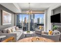 Cozy living room with modern decor, comfortable seating, city view, and stylish lighting at 3325 Piedmont Ne Rd # 2407, Atlanta, GA 30305