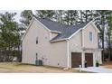 Two-story house with brick and siding, two-car garage, and landscaping at 3405 Summer Brooke Way, Union City, GA 30291