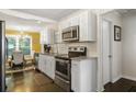 Modern kitchen with stainless steel appliances and granite countertops at 1385 Kenilworth Sw Dr, Atlanta, GA 30310