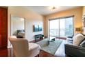 Living room with hardwood floors and city view at 361 17Th St # 2001, Atlanta, GA 30363