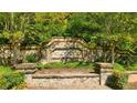 Stone entry sign for the Wildwood community at 13232 Tolstoy Dr, Covington, GA 30014