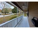 Long front porch with white railings, providing a relaxing outdoor space at 1129 Gate Post Ln, Lawrenceville, GA 30044