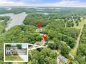 Overhead shot of the lakefront property, featuring a private dock, lake access, and lush greenery at 6006 Lanier Heights Cir, Buford, GA 30518
