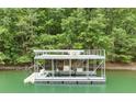 A two-story dock sits in the water, with upper deck furniture, stairs, and access to the lake at 6006 Lanier Heights Cir, Buford, GA 30518